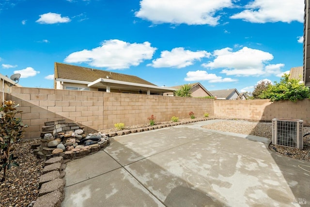 view of patio / terrace with central AC unit and a fenced backyard