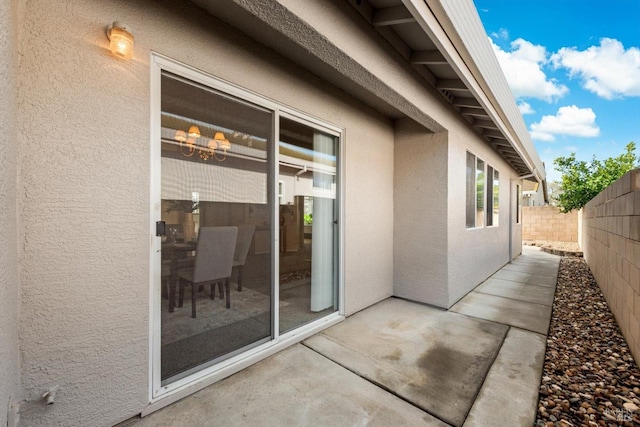 view of patio featuring fence