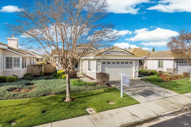 ranch-style home featuring driveway, a front yard, and a garage