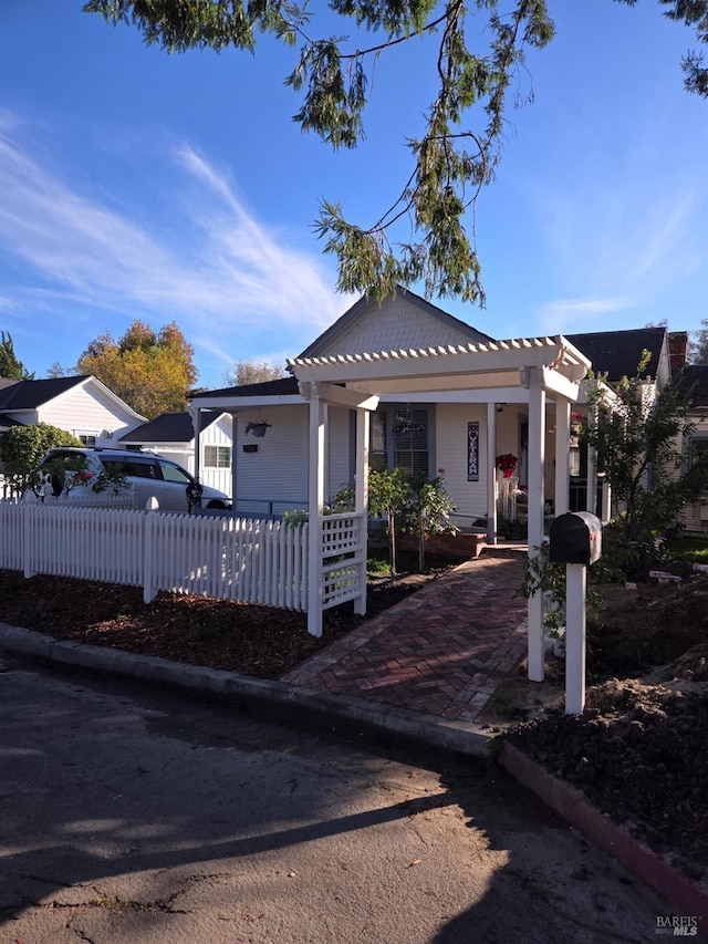 bungalow-style home featuring a fenced front yard