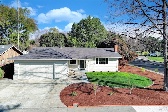 ranch-style home featuring a garage, a shingled roof, concrete driveway, a front lawn, and a chimney