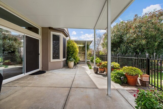 view of patio / terrace featuring fence