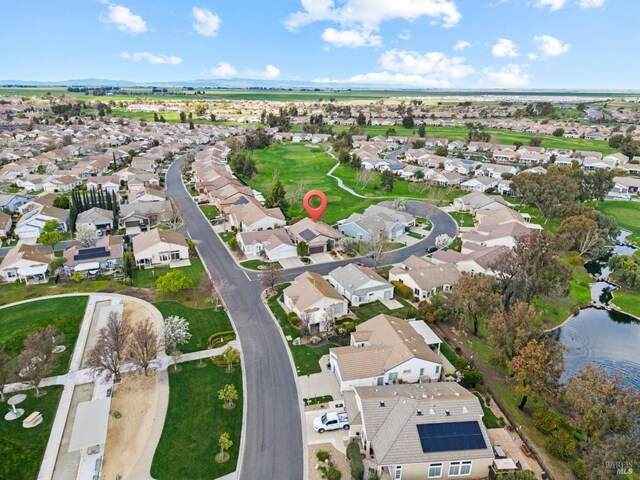 bird's eye view with a residential view and a water view