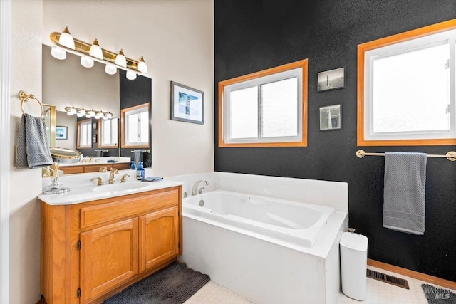 full bathroom with a bath, visible vents, and vanity