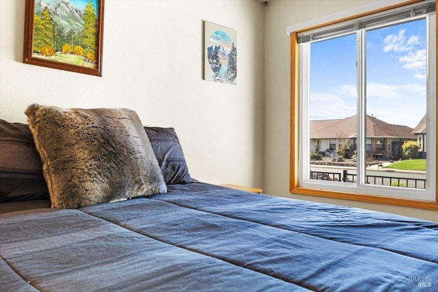 bedroom with multiple windows