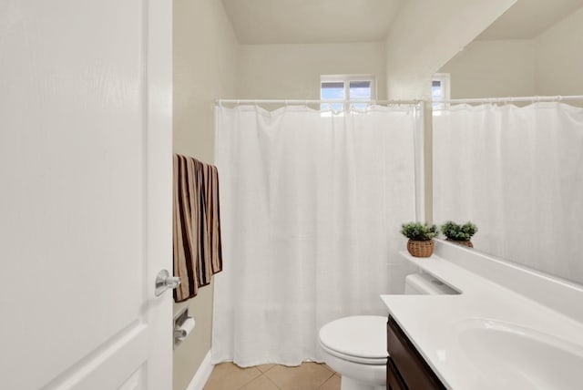 bathroom featuring toilet, curtained shower, tile patterned flooring, and vanity