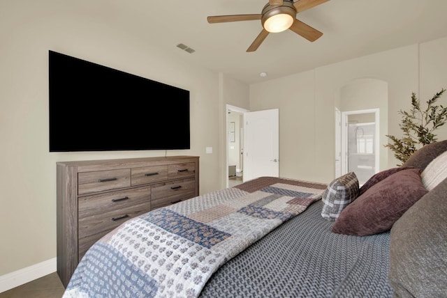 bedroom featuring tile patterned flooring, visible vents, ceiling fan, and baseboards