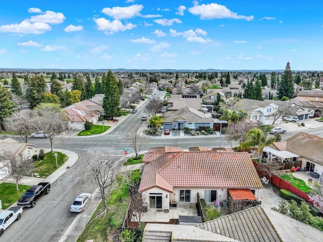 birds eye view of property with a residential view