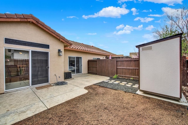 view of yard featuring a patio, central AC unit, and fence