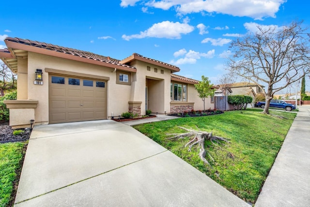 mediterranean / spanish home with a garage, concrete driveway, a tiled roof, stucco siding, and a front yard