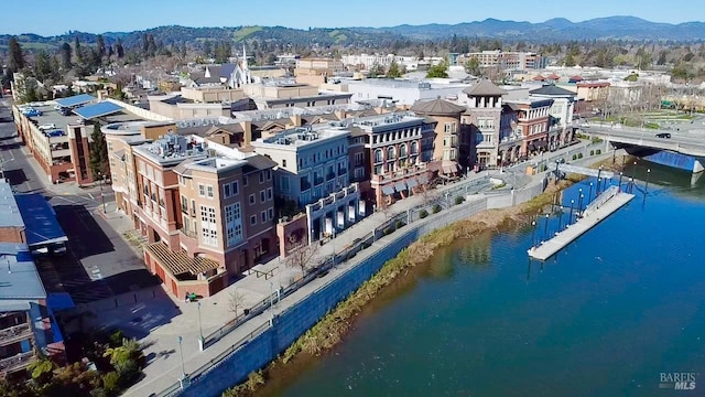 bird's eye view with a water and mountain view