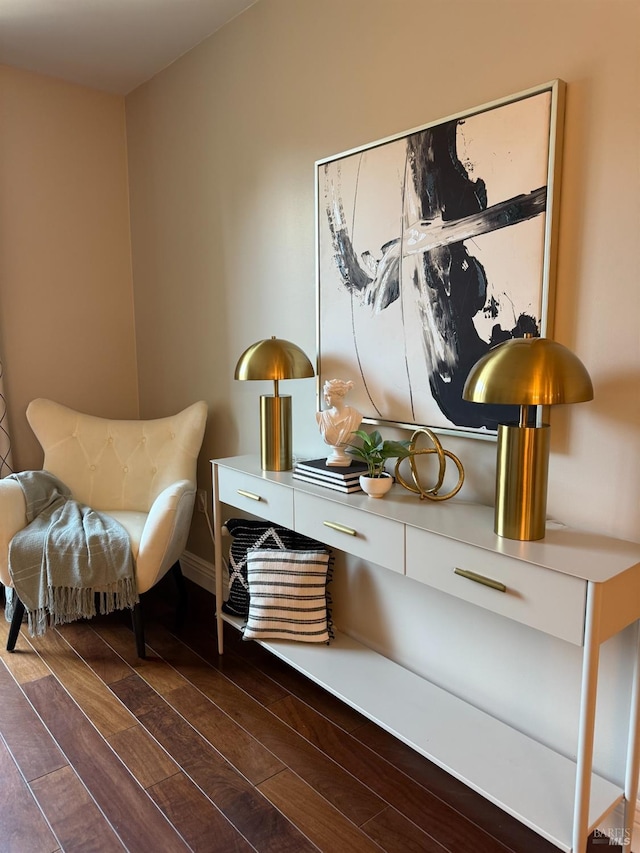 living area with dark wood-style floors and baseboards