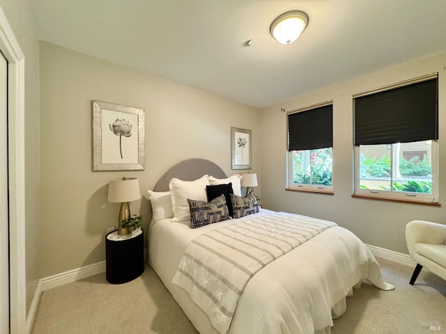 bedroom with carpet and baseboards