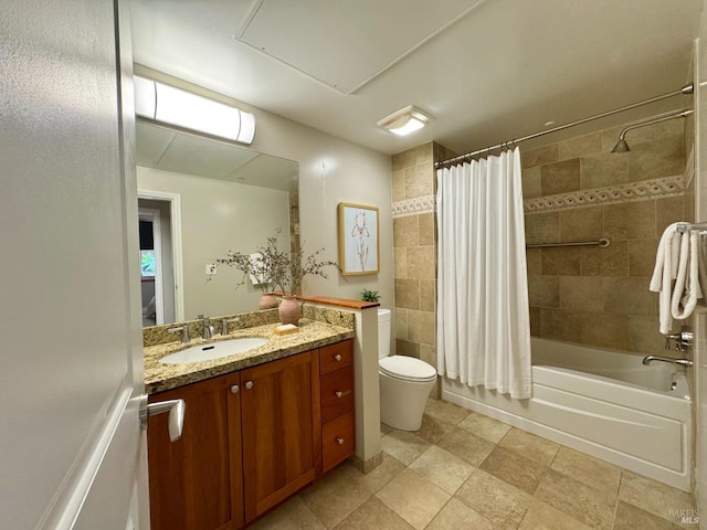 bathroom featuring vanity, toilet, and shower / bath combo with shower curtain