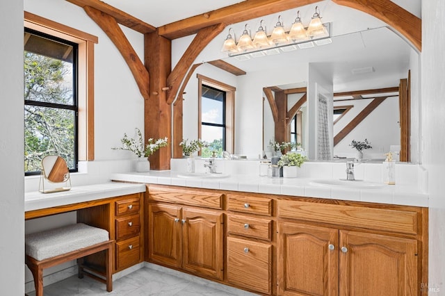 full bathroom featuring marble finish floor, a sink, and double vanity