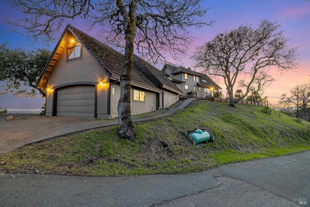 view of front facade with driveway and an attached garage