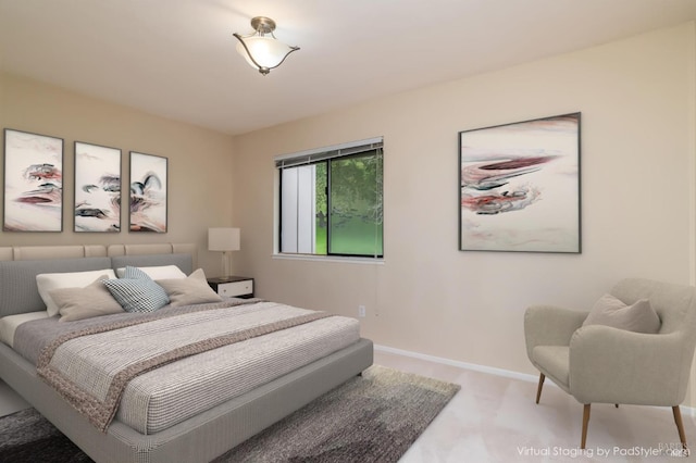 bedroom featuring baseboards and carpet