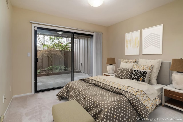 carpeted bedroom with visible vents, baseboards, and access to outside