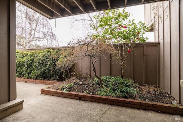 exterior space with a patio and fence