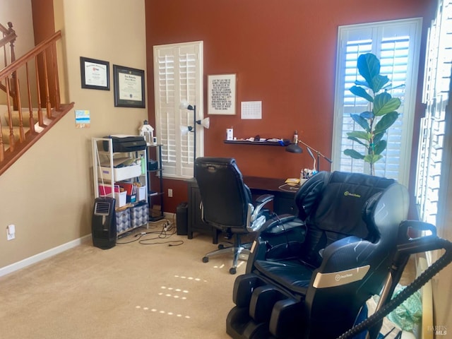 carpeted home office with baseboards