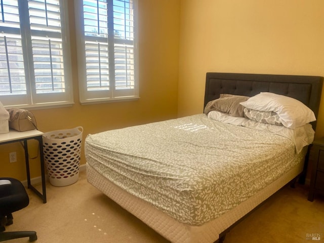 carpeted bedroom with baseboards