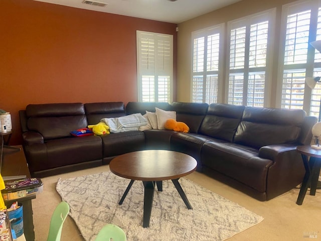 carpeted living room with visible vents