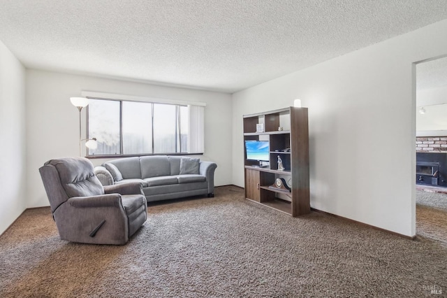 living room featuring a textured ceiling and carpet