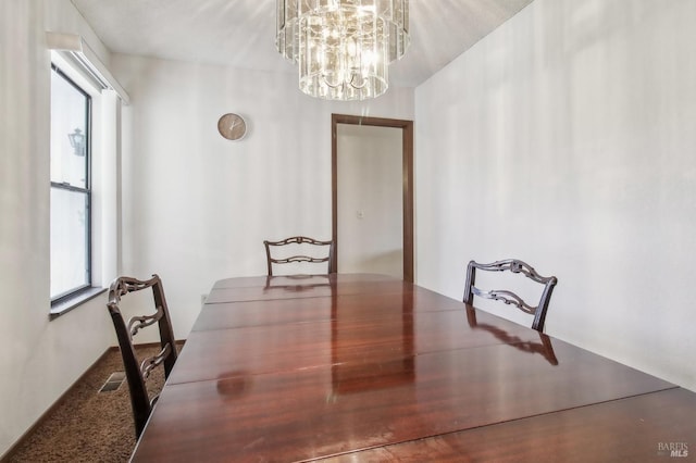 dining room featuring a chandelier