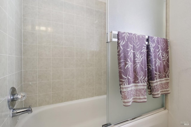 full bath featuring combined bath / shower with glass door