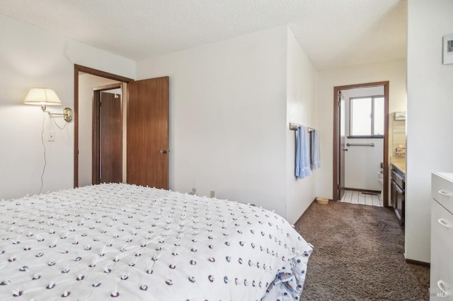 carpeted bedroom with a textured ceiling