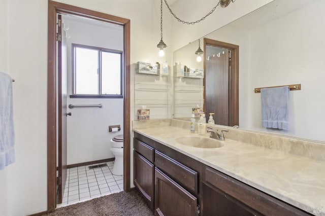 bathroom featuring tile patterned flooring, visible vents, baseboards, toilet, and vanity