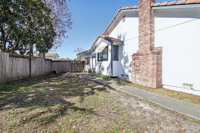 exterior space featuring a fenced backyard