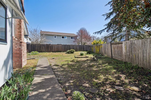 view of yard with a fenced backyard