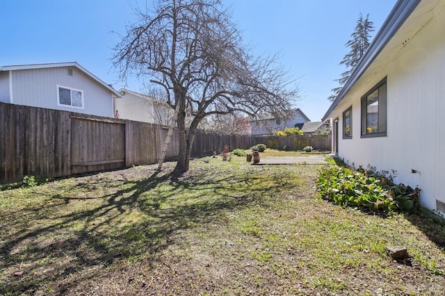 view of yard with a fenced backyard