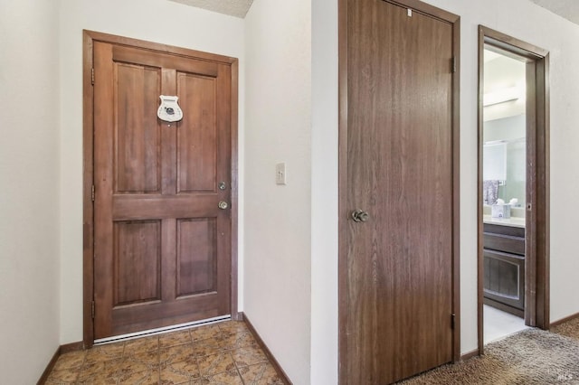 interior space featuring baseboards