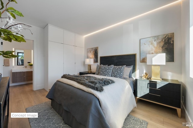 bedroom featuring a closet and light wood-style floors