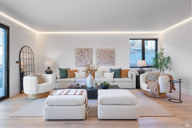 living room featuring wood finished floors and baseboards