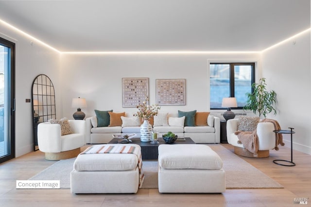 living room with baseboards and wood finished floors