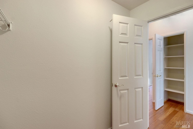 hallway featuring light wood-style floors