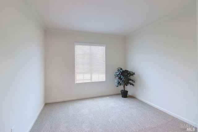 unfurnished room featuring carpet, crown molding, and baseboards