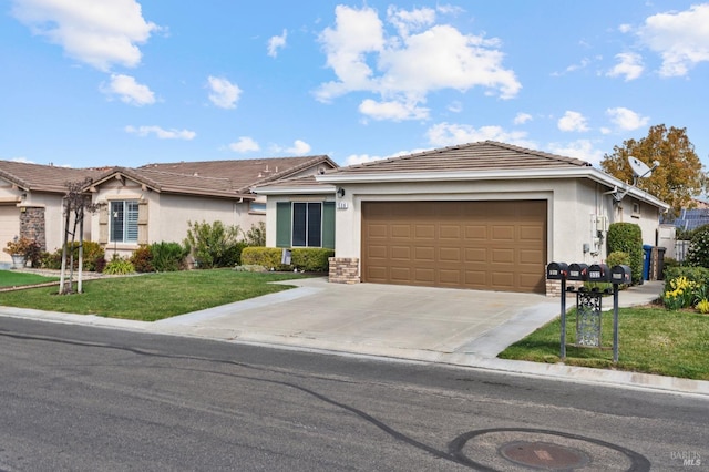 single story home with a garage, driveway, a front yard, and stucco siding