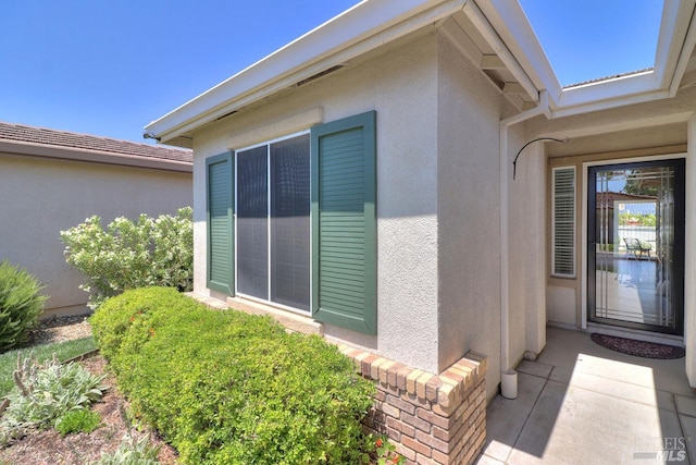 view of home's exterior with stucco siding