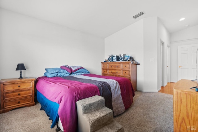 carpeted bedroom featuring baseboards, visible vents, and recessed lighting