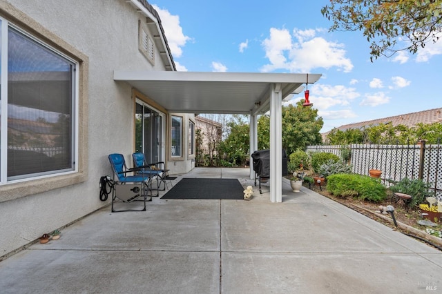 view of patio / terrace featuring fence