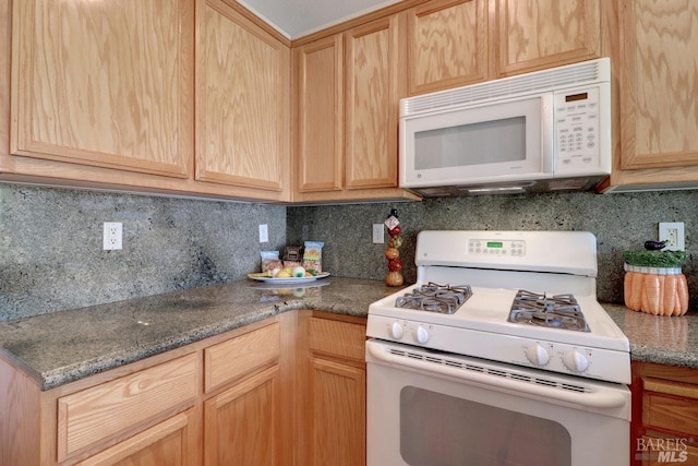 kitchen with white appliances, tasteful backsplash, and light brown cabinetry