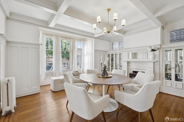 2401 Jackson St Unit 3, San Francisco, CA 94115 - dining room with a decorative wall, coffered ceiling, a chandelier, beam ceiling, and ornamental molding