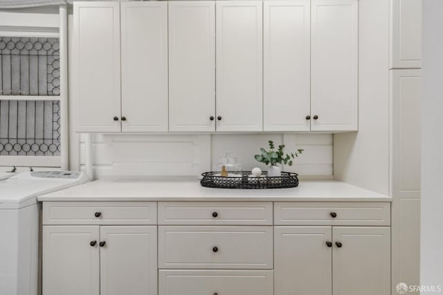 2401 Jackson St Unit 3, San Francisco, CA 94115 - laundry room with cabinet space and washer / dryer