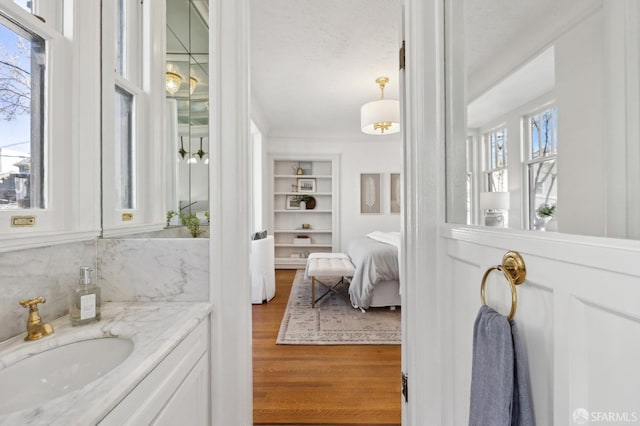 2401 Jackson St Unit 3, San Francisco, CA 94115 - bathroom featuring wood finished floors, built in features, and vanity