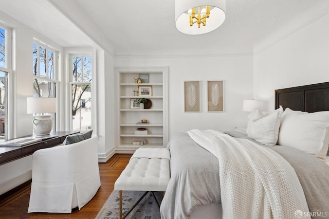 2401 Jackson St Unit 3, San Francisco, CA 94115 - bedroom with wood finished floors and a chandelier