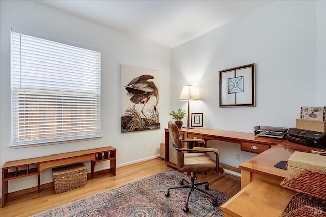 office area featuring baseboards and wood finished floors